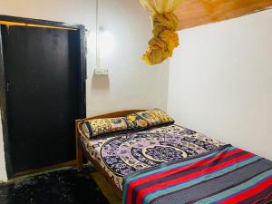 Postel nebo postele na pokoji v ubytování Jama’s Stay