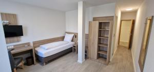 Postel nebo postele na pokoji v ubytování Hotel Ladage