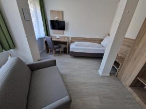 Postel nebo postele na pokoji v ubytování Hotel Ladage