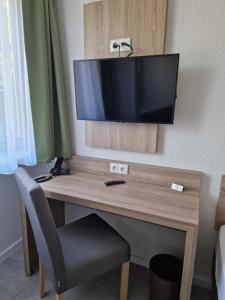 TV a/nebo společenská místnost v ubytování Hotel Ladage