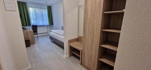 Postel nebo postele na pokoji v ubytování Hotel Ladage