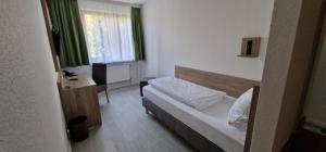 Postel nebo postele na pokoji v ubytování Hotel Ladage