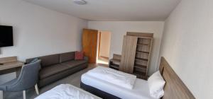 Postel nebo postele na pokoji v ubytování Hotel Ladage
