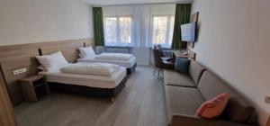Postel nebo postele na pokoji v ubytování Hotel Ladage