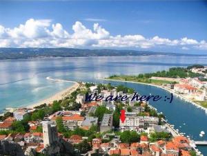 an aerial view of a beach with the words we are here at Apartment Vicko in Omiš +15 photos
