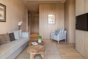 a living room with a couch and a table at The Margi in Athens