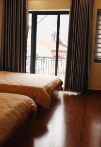 Postel nebo postele na pokoji v ubytování Anita homestay Dalat