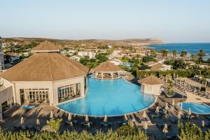 an aerial view of a resort with a swimming pool at Atlantica Mare Village Ayia Napa in Ayia Napa