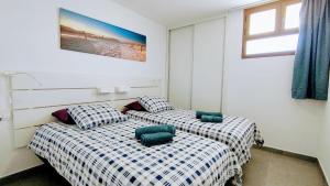 Posteľ alebo postele v izbe v ubytovaní mirador del 6th