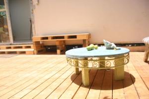 a table with fruit on top of it in a room at House of Love in Pardes H̱anna