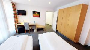 Postel nebo postele na pokoji v ubytování GHOTEL hotel & living Kiel