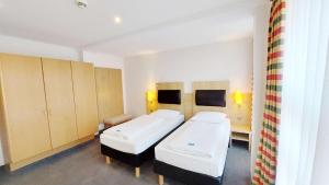 Postel nebo postele na pokoji v ubytování GHOTEL hotel & living Kiel