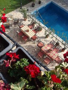 an overhead view of a patio with a table and chairs and a pool at Villa Diana Apartments in Skopje