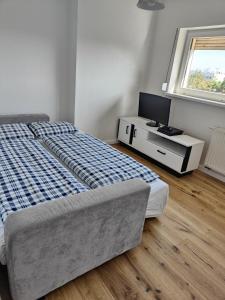Postel nebo postele na pokoji v ubytování Dom Dąbrówka Poznań