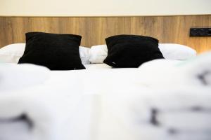 Łóżko lub łóżka w pokoju w obiekcie Bakea by Smiling Rentals