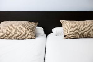 Łóżko lub łóżka w pokoju w obiekcie Bakea by Smiling Rentals