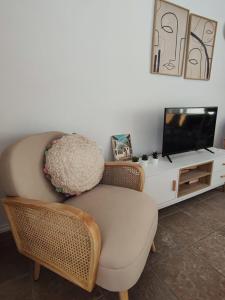 Televízia a/alebo spoločenská miestnosť v ubytovaní ACAPULCO PLAYA 26 MENYBER