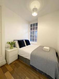 En eller flere senger på et rom på Westminster Apartment near River Thames