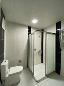 a bathroom with a toilet and a shower at OTEL KING in Isparta