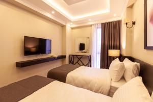TV a/nebo společenská místnost v ubytování Lilium Luxury Suites