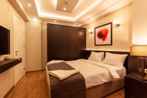 Postel nebo postele na pokoji v ubytování Lilium Luxury Suites