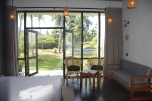 Posezení v ubytování Mango Tree Villa Bentota