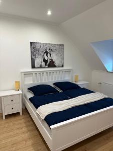 Postel nebo postele na pokoji v ubytování Stadthaus Apartment Bachperle