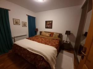 Katil atau katil-katil dalam bilik di Villa Diana Apartments