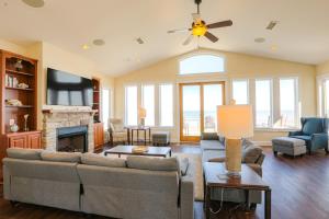 a living room with a couch and a fireplace at Magic Moments 999 in Avon