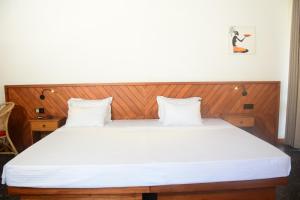 Postel nebo postele na pokoji v ubytování Mango Tree Villa Bentota