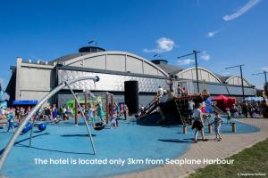 a group of people playing in a playground at Centennial Nexus Hotel Tallinn in Tallinn