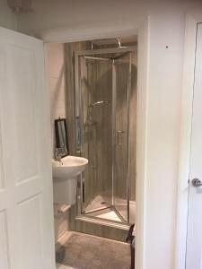 a bathroom with a shower and a sink at The Guest Suite, Buttsfield Lane. in East Hoathly