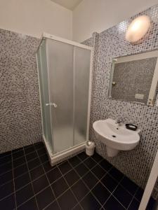 a bathroom with a shower and a sink at Reznicka Apartments in Prague