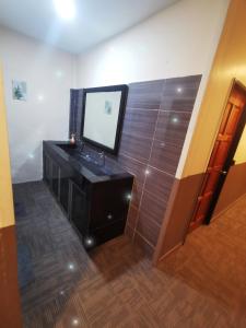 a bathroom with a sink and a mirror at Marvel Suite ABNB in Port Dickson