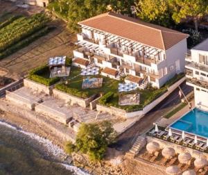 an aerial view of a house with a swimming pool at Amaltheia Beach Front Houses in Kypseli