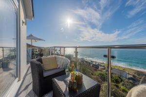 a balcony with a view of the ocean at Blue Yonder, Praa Sands in Praa Sands +15 photos