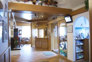 A television and/or entertainment centre at Liz Hotel & Apartments