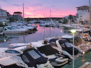 a group of boats docked in a marina at sunset at A&A Brothers Port d'Aro in Platja d'Aro