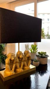 a group of monkey statues sitting on a table at Hôtel La Villa Cannes in Cannes