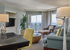 a living room with a couch and a table at Loews Coronado Bay Resort in San Diego