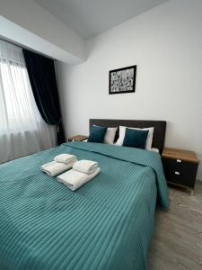 Cozy Apartments - City Center tesisinde bir odada yatak veya yataklar