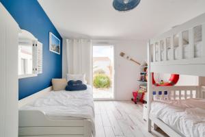 Posteľ alebo postele v izbe v ubytovaní Maison pour 9 - Jacuzzi - 300m de la plage