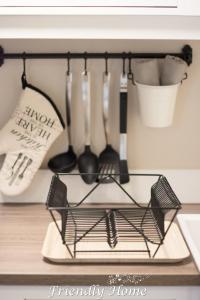 a rack of utensils on a kitchen counter at Friendly Home - Doppelappartement "Vitality" Koeln Bonn Phantasialand in Brenig