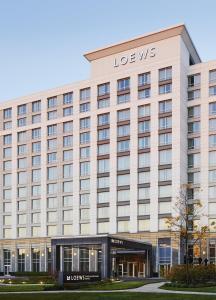 a large building with a louis vuitton hotel at Loews Chicago O'Hare Hotel in Rosemont