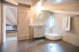 a bathroom with a sink and a toilet at Villa Cretan View with Heated Swimming Pool in Pátima +26 photos