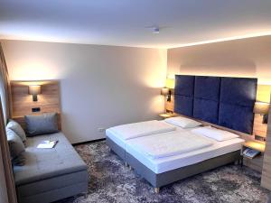 Postel nebo postele na pokoji v ubytování Appartment-Hotel-Hölzl