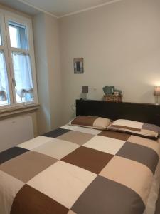 Ένα ή περισσότερα κρεβάτια σε δωμάτιο στο Residenza Il principe, Bilocale 2 in centro