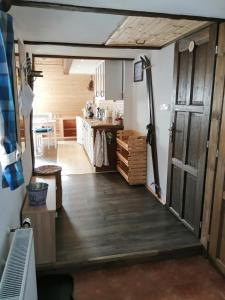 a garage with a door open to a kitchen at Apartmán Dvě Micky in Pec pod Sněžkou