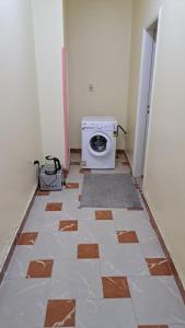 a room with ailed floor with a stove in it at Sweet Home- No Egyptian in Hurghada