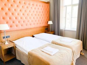Ένα ή περισσότερα κρεβάτια σε δωμάτιο στο Billnäsin ruukki
